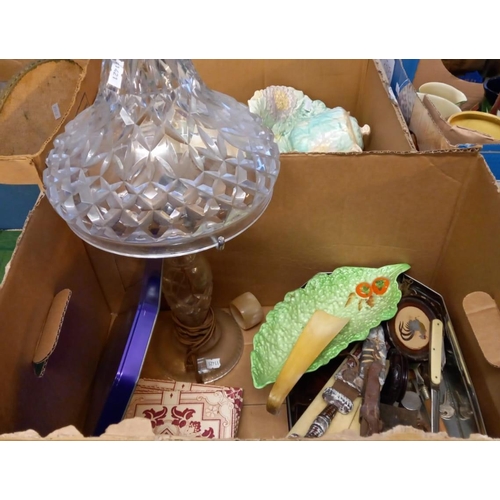 394 - Box of assorted melalware, candlesticks etc.  and a box of oddments to include: cut glass table lamp... 