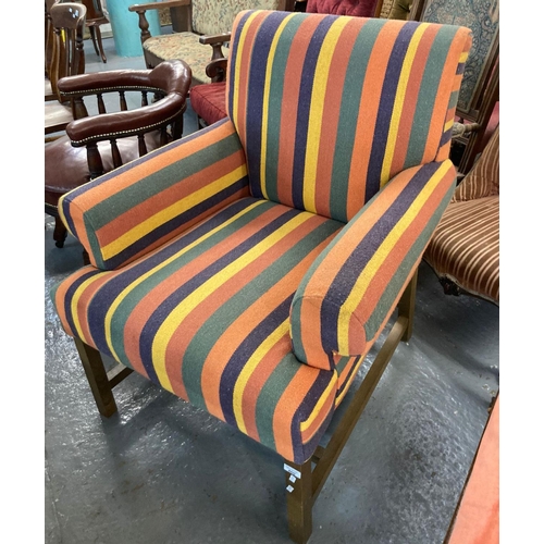 460 - Early 20th century multicoloured fabric armchair on an oak frame.  (B.P. 21% + VAT)