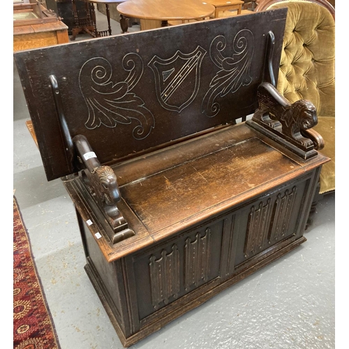 467 - 20th century oak Monks bench, plaque to the interior 'L. Marcus ltd'.  (B.P. 21% + VAT)