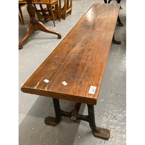 477 - Early 20th century pine top cast iron bench with pine stretcher together with a 20th century oak and... 