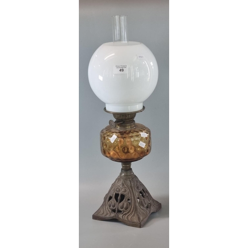 49 - Early 20th century double oil burner lamp having globular opaline glass shade above an amber glass r... 