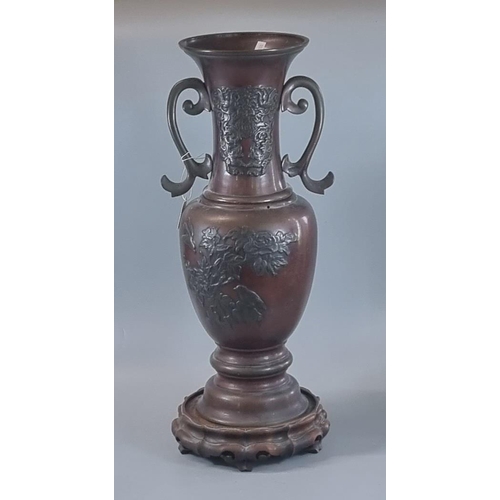 62 - Japanese bronze Meiji period two handled baluster vase on probably associate hardwood base.  The vas... 