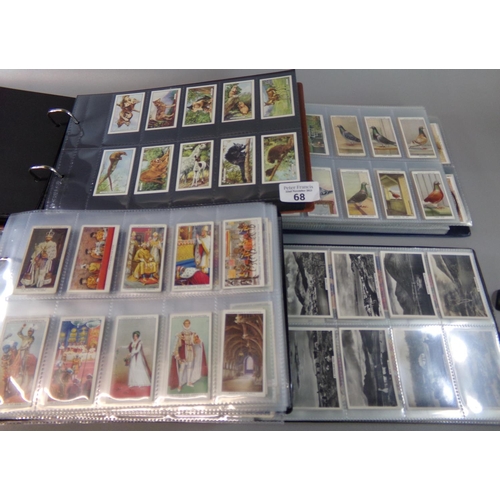 68 - Cigarette cards, collection in four albums, Senior Service, Ogdens, Players, Wills etc.  good range ... 