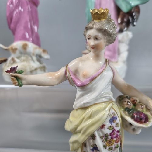 130 - Set of five continental porcelain figurines of ladies with birds, baskets and musical instruments.  ... 