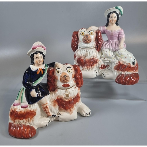 153 - Pair of 19th century Staffordshire Pottery figures of red and white Spaniel type recumbent dogs with... 