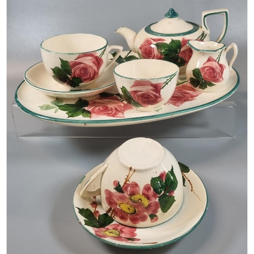 156 - 19th century Llanelly pottery cabaret set in the 'Rose' design comprising: two cups and saucers, bul... 