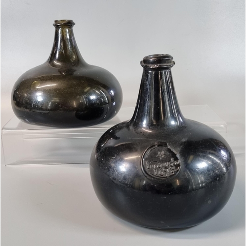 180 - Two 17th century green glass Onion bottles, one  with seal marked 'Jurdanston 1698' (sic), believed ...