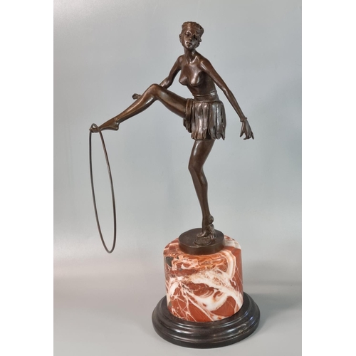 184 - After D Alonzo, an Art Deco style bronze of a semi-nude female dancer with hoop on he outstretched f... 