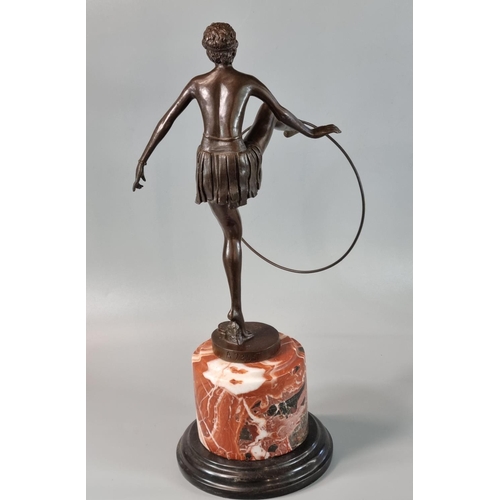 184 - After D Alonzo, an Art Deco style bronze of a semi-nude female dancer with hoop on he outstretched f... 