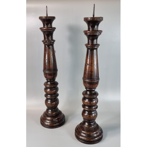 188 - Pair of 18th century oak Pricket candlesticks of baluster form. 53cm high approx.  (B.P. 21% + VAT)