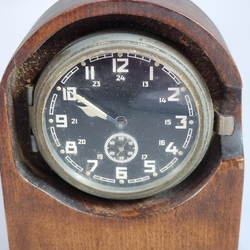 191 - WWII period German aircraft clock, now set in a wooden mantle case, opening to reveal script 'Heeres... 