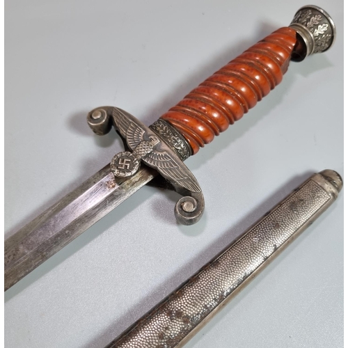 192 - German WWII period Army type dress dagger, having acorn leaf crown design pommel above orange compos... 