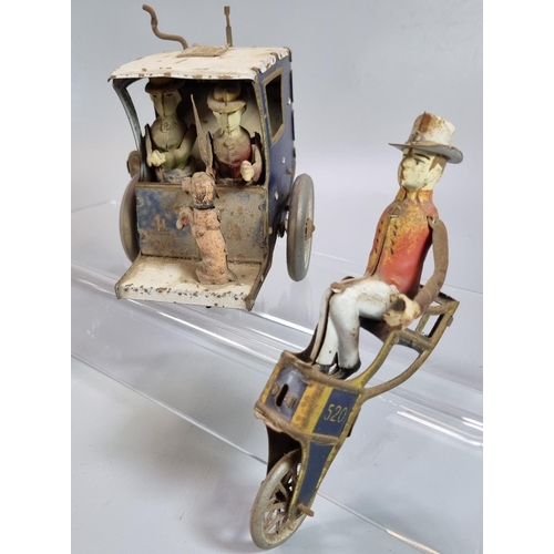 197 - Lehmann's tinplate clockwork Hansom Cab with two passengers and dog, the driver seated above a third... 