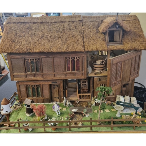 197B - Well made and attractive collector's dolls house in the form of a thatched 17th century Mill House, ... 