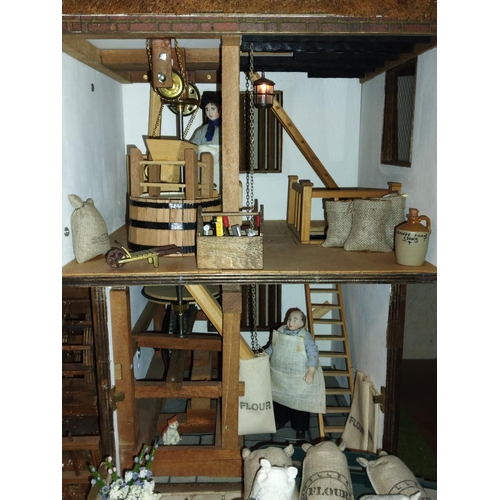 197B - Well made and attractive collector's dolls house in the form of a thatched 17th century Mill House, ... 