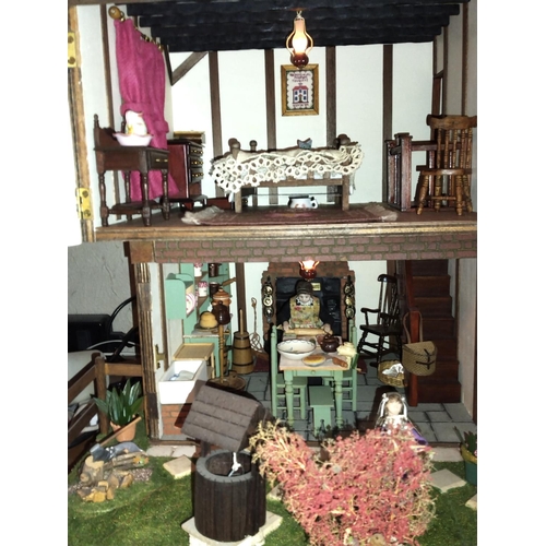 197B - Well made and attractive collector's dolls house in the form of a thatched 17th century Mill House, ... 