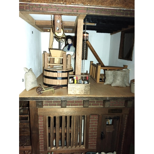 197B - Well made and attractive collector's dolls house in the form of a thatched 17th century Mill House, ... 