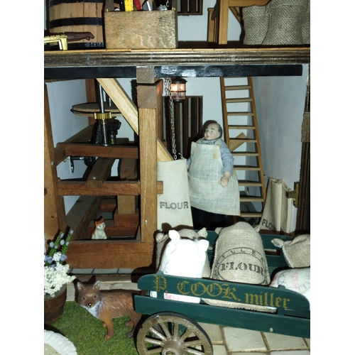 197B - Well made and attractive collector's dolls house in the form of a thatched 17th century Mill House, ... 