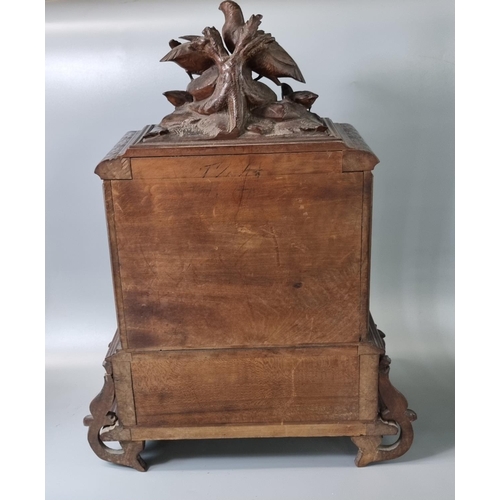 207 - Late 19th century Black Forest walnut Humidor, the top carved with partridge and young above two doo... 