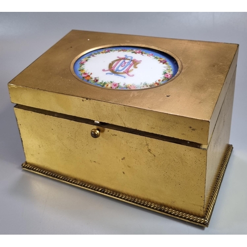 214 - Late 19th century brass fall front stationery box, the top inset with porcelain panel/tablet in Sevr... 