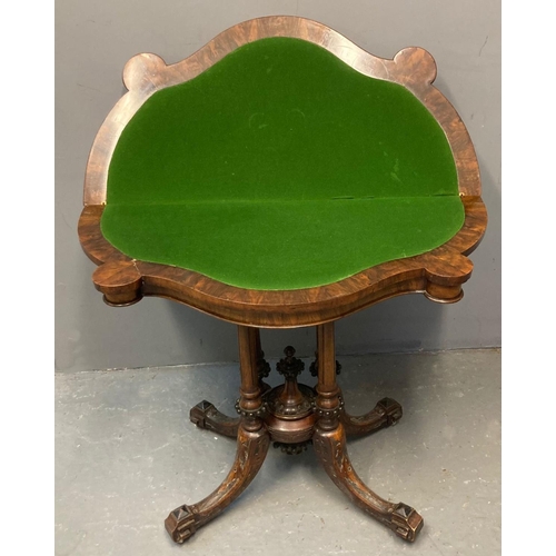 26 - Victorian walnut fold over card table, the moulded and shaped top with hinged lid, above carved quat... 
