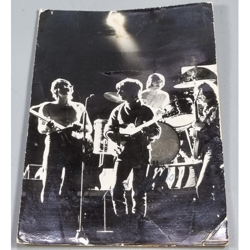 260 - An original 1960s Beatles postcard in black and white featuring the band playing, and with facsimili... 