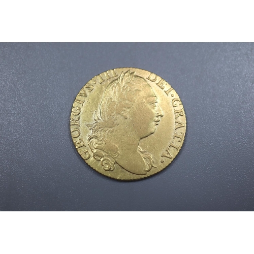 310 - George III 1774 gold Guinea.  8.4g approx.   (B.P. 21% + VAT)