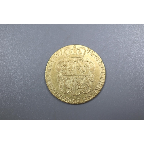 310 - George III 1774 gold Guinea.  8.4g approx.   (B.P. 21% + VAT)