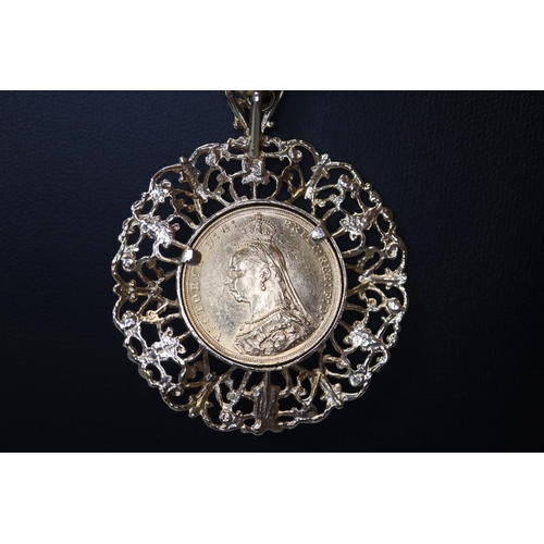 313 - Late Victorian gold full Sovereign dated 1893 in ornate 9ct gold pendant mount together with a 9ct g... 