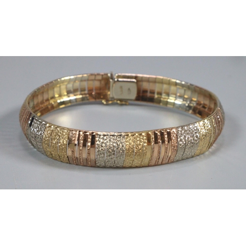 320 - 18ct gold ladies bracelet/bangle with varying gold tones marked 750.  1.2cm width approx.  27.3g app... 