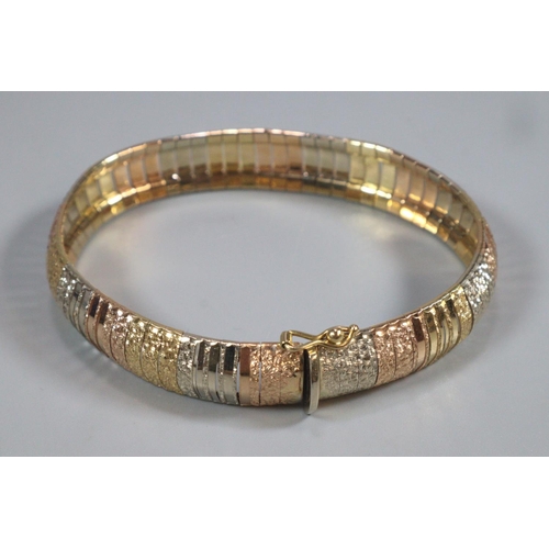 320 - 18ct gold ladies bracelet/bangle with varying gold tones marked 750.  1.2cm width approx.  27.3g app... 