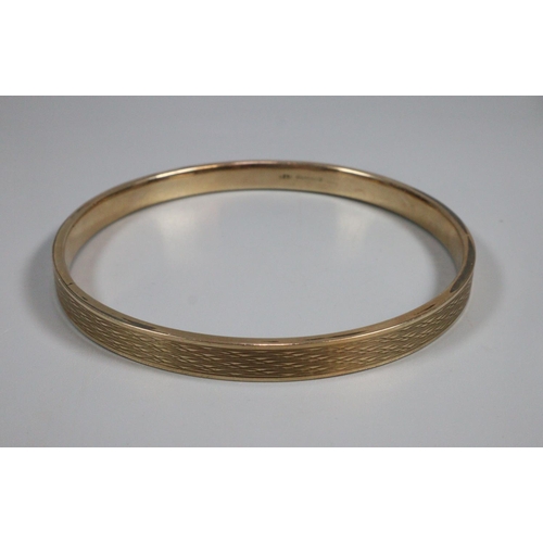 322 - 9ct gold textured bangle, Birmingham hallmarks, makers name B & S.  8.5cm diameter.  12.5g approx.  ... 