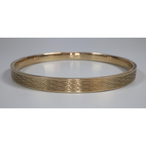 322 - 9ct gold textured bangle, Birmingham hallmarks, makers name B & S.  8.5cm diameter.  12.5g approx.  ... 