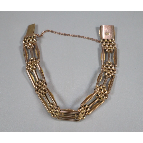 323 - 15ct gold three bar gate bracelet.  Marked 15c.  18cm long approx. 1.1cm wide approx.  23.3g approx.... 