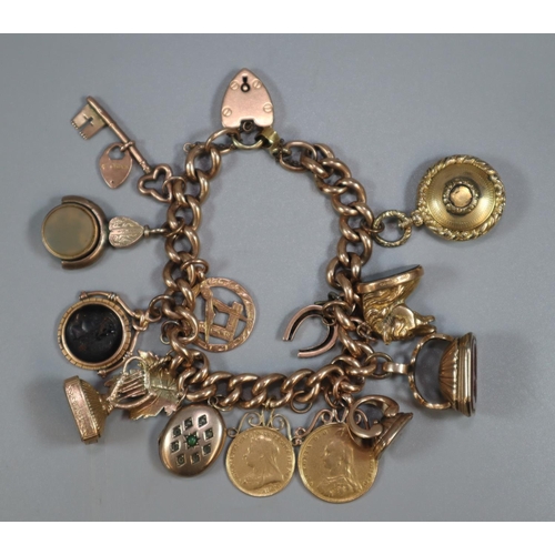 326 - 9ct gold curb link charm bracelet with assorted charms including: Masonic, harp, Intaglio seal fobs ... 