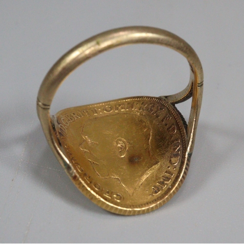 334 - George V shaped gold sovereign dated 1912 fixed to a 9ct gold ring mount.  9.6g approx.  (B.P. 21% +... 