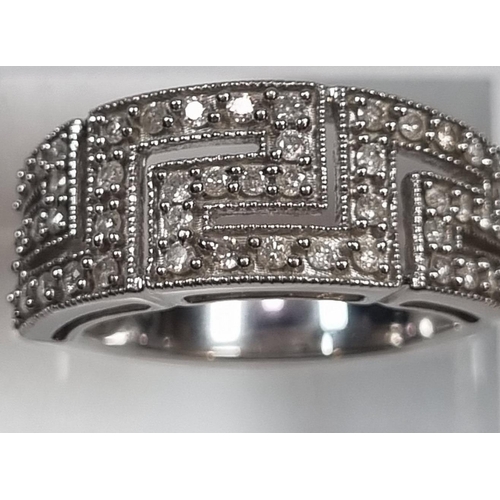 342 - 9ct white gold Greek Key design diamond ring.  6.3g approx.  Size N.  (B.P. 21% + VAT)