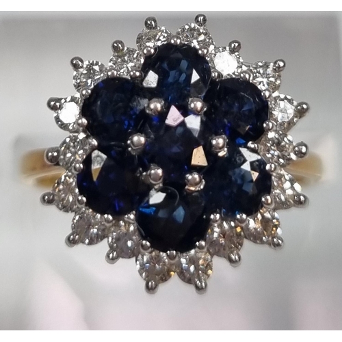 344 - 18ct gold diamond and sapphire ring comprising eighteen diamonds and seven sapphires.  5.2g approx. ... 