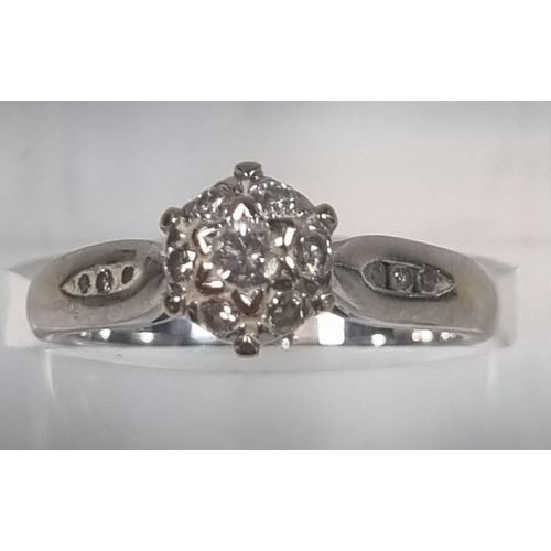 349 - 18ct white gold seven stone diamond ring set with a further three diamond chips to each shoulder, ma... 