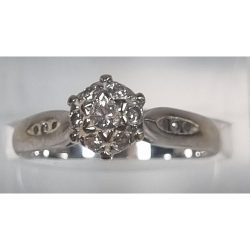 349 - 18ct white gold seven stone diamond ring set with a further three diamond chips to each shoulder, ma... 