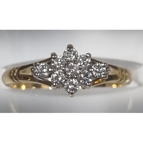 351 - 18ct gold nine stone diamond ring of flowerhead form.  2.8g approx.  Size L1/2.  (B.P. 21% + VAT)