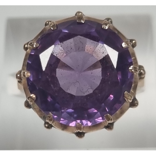 355 - 14ct gold large amethyst facetted ring in claw setting.  5.4g approx.  Size M1/2.  (B.P. 21% + VAT)