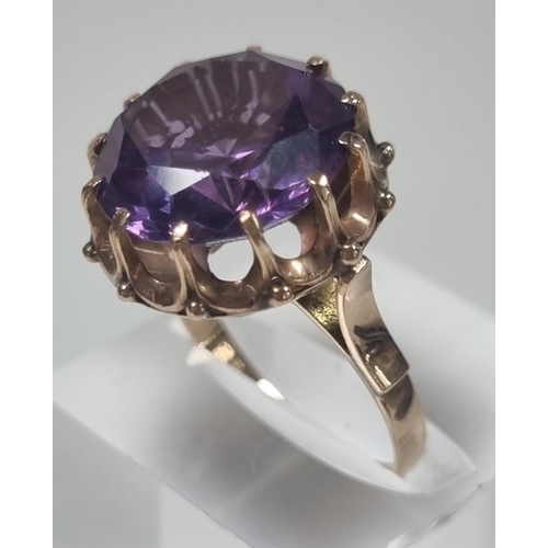 355 - 14ct gold large amethyst facetted ring in claw setting.  5.4g approx.  Size M1/2.  (B.P. 21% + VAT)