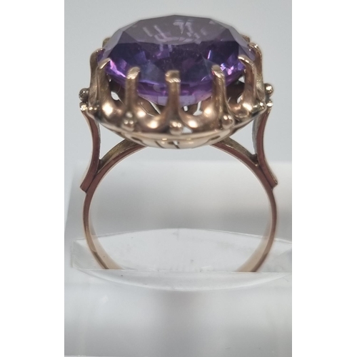 355 - 14ct gold large amethyst facetted ring in claw setting.  5.4g approx.  Size M1/2.  (B.P. 21% + VAT)