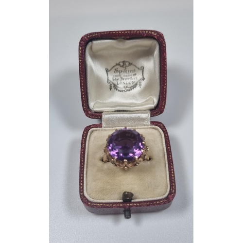 355 - 14ct gold large amethyst facetted ring in claw setting.  5.4g approx.  Size M1/2.  (B.P. 21% + VAT)