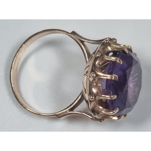 355 - 14ct gold large amethyst facetted ring in claw setting.  5.4g approx.  Size M1/2.  (B.P. 21% + VAT)