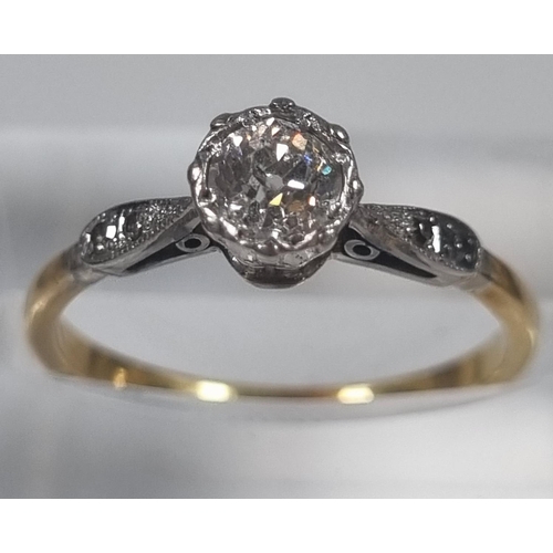 358 - Yellow metal, probably 18ct gold diamond solitaire ring flanked by two further tiny diamonds set to ... 