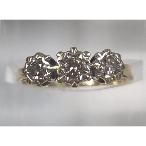 359 - 18ct gold three stone diamond ring in crown setting, the central stone 0.30 carat.  2.9g approx.  Si... 