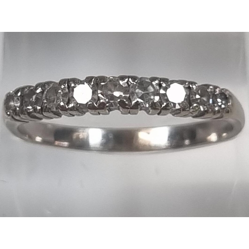 362 - White metal nine stone diamond ring.  (No weight)  Size T.  (B.P. 21% + VAT)