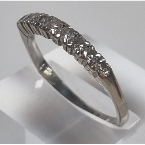 362 - White metal nine stone diamond ring.  (No weight)  Size T.  (B.P. 21% + VAT)